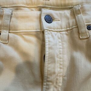 Chico’s so slimming girlfriend rolled cuff ankle jeans. Pale yellow